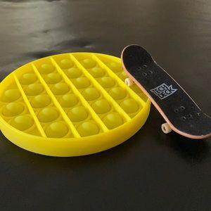 Pop it fidget toy/game and a tech deck